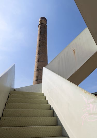 a staircase case with graffiti on it, and a tower