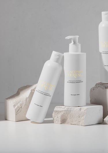a group of white bottles of hair products