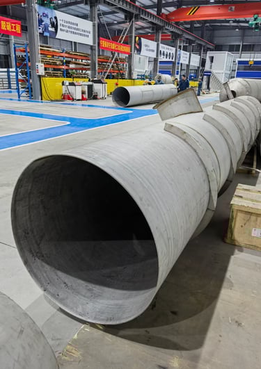 PMI Piping a large welded pipe in workshop