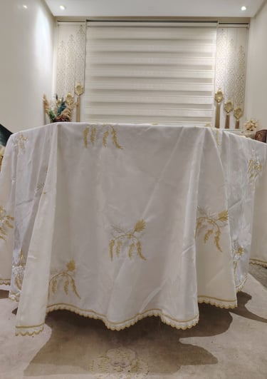 a table with a table cloth and a chair