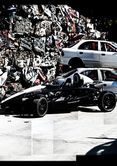 A photo joiner of an ariel atom in a junk yard.