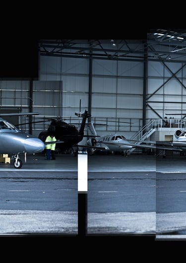 A joiner photo of executive jets in a hanger