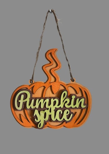 Pumpkin-shaped wooden hanging sign for home decor.
