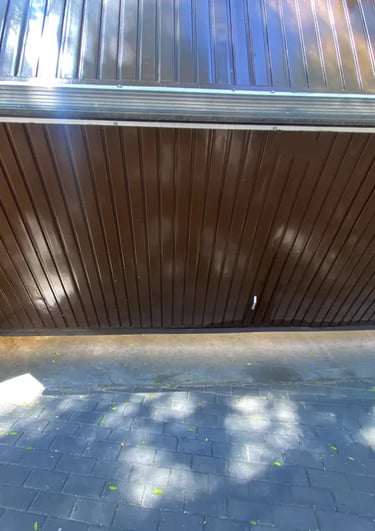 a parking garage door with a large wooden door