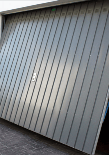 a garage door with a large metal door and a large garage door