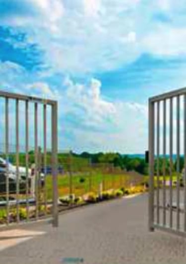 a gated in area with a fenced in area with a fenced in