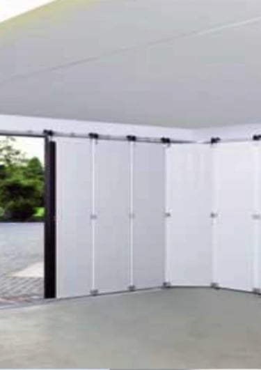 a car parked in a garage with a car in the background