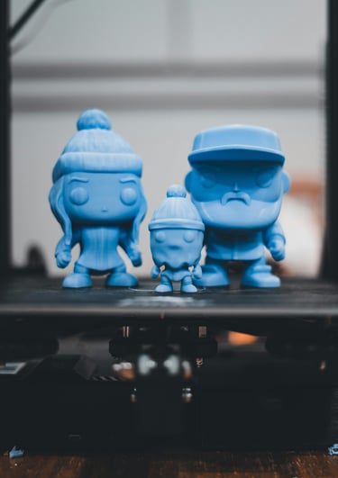 a group of blue toy figures sitting on top of a table