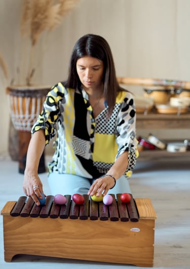a woman playing a musical instrument with a musical instrument