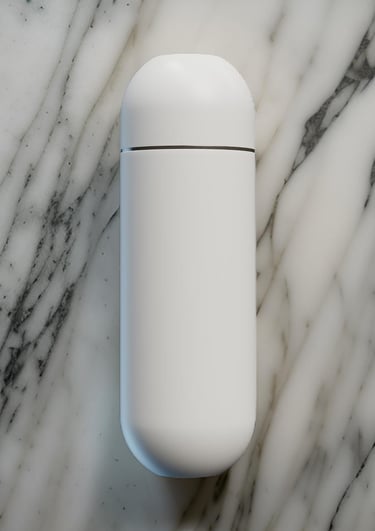a Pearl White portable water bidet with a marble background