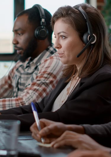 a woman in a headset with a man in a headset
