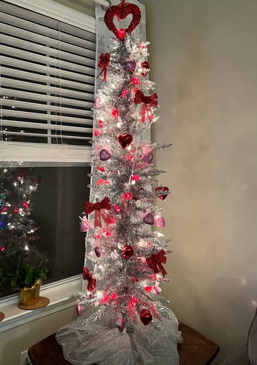 Silver metallic Skinny tree with Valentine's Day Decorations: Hearts, Bows, Heart lights.