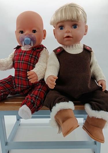 Baby Born and Big Sister dolls dressed in tartan and corduroy overalls