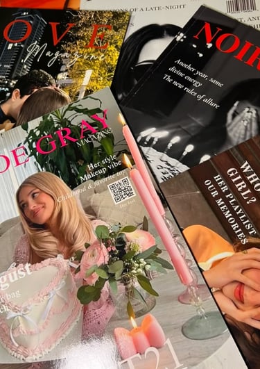 A collection of fashion magazines and aesthetic lifestyle books featuring pink candles and floral arrangements.