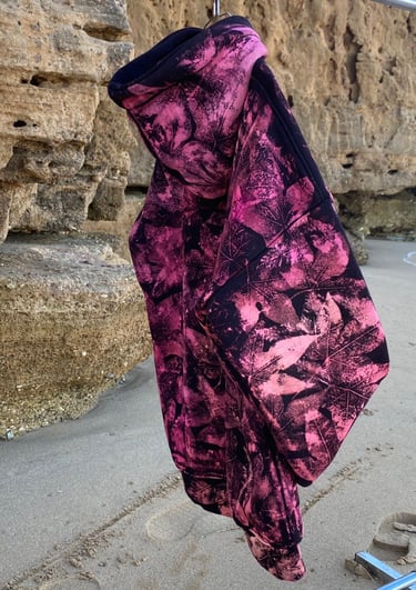 a pair of gloves hanging on a clothes line