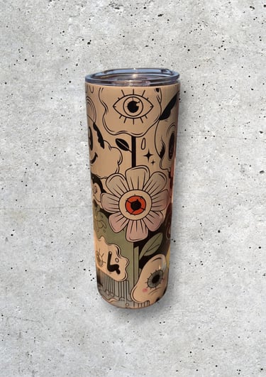 a cup of coffee with a flower on it