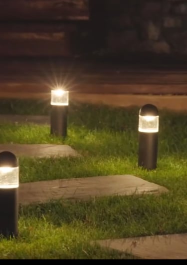 soft warm glowing pathway lights illuminating walkway.