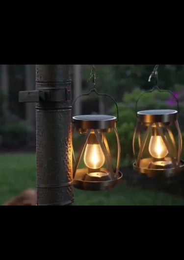 Compact decorative lanterns hanging from pole.