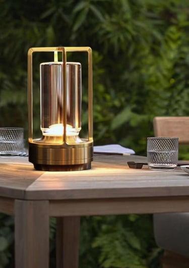 glowing lantern on table in backyard.
