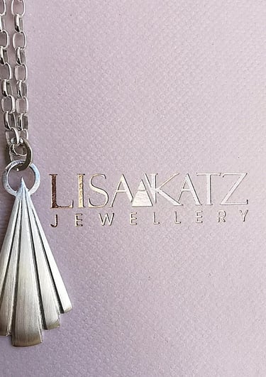 Handmade Lisa Katz sterling silver fan pendant necklace on a branded jewelry display card.