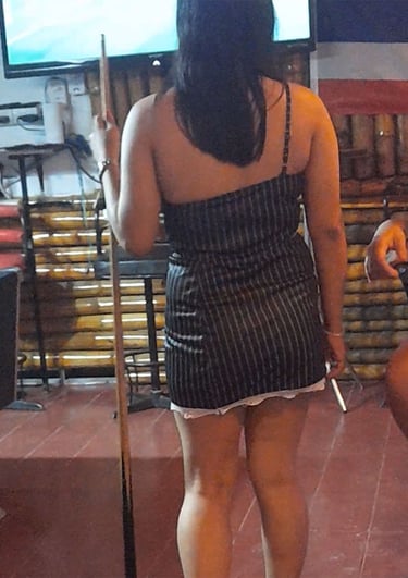 Thai woman playing pool at bar on Soi 94 in Hua Hin