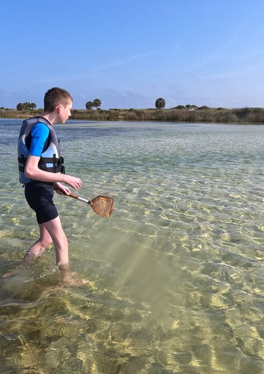 a man in a life jacket is holding a paddle paddle and paddle paddle