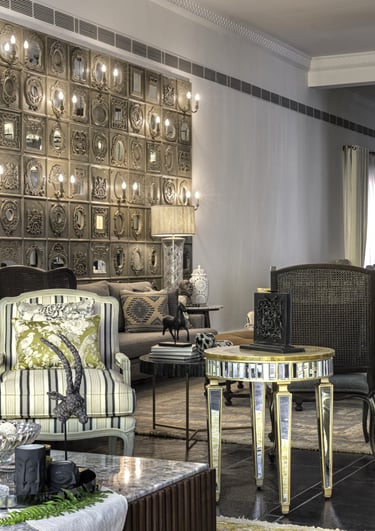 a living room with a couch and chairs