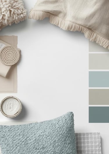 Flat lay of color swatches and fabrics for a calming home palette.