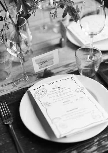 black and white image of a menu and wedding set up