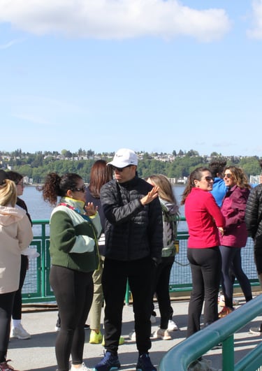 team on the Seattle ferry heading to Bainbridge Island for a team building retreat