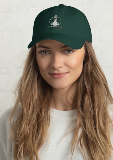 A woman wearing a dark green baseball cap with the Silly Goose Recordings logo.