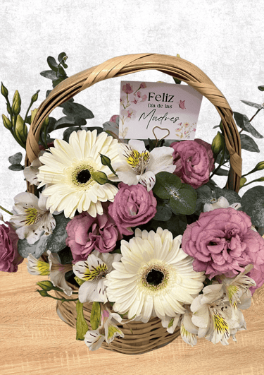Canasta floral con lisianthus, gerberas, dolar y astromela en tonos rosa y blanco