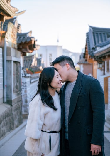 a man and woman standing in Hanok Village