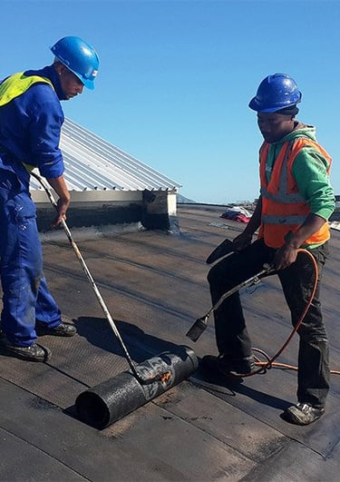 Tswanacrete is ABE Torch-On bituminous membrane — long-lasting waterproofing solution for roofs, terraces, and exposed area