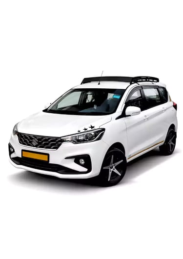 White Maruti Ertiga one way taxi by Saini taxi services with a luggage carrier rack