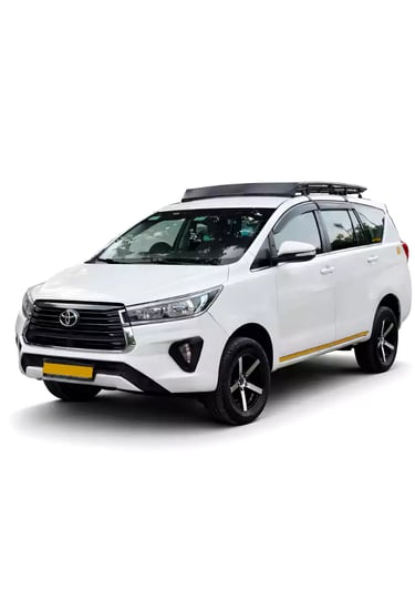 White Toyota Innova Crysta one way taxi by Saini taxi services with a luggage carrier rack