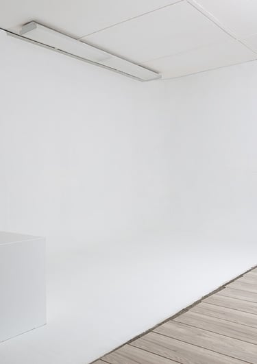 a Cyclorama with a white backdrop and a white posing box