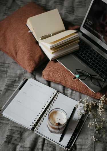 “Calm workspace with warm light, notebook, and coffee symbolizing a gentle approach to online income