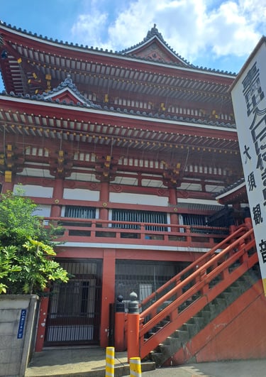 Traditional red and white Japanese temple architecture at Osu Kannon in Nagoya, Japan.