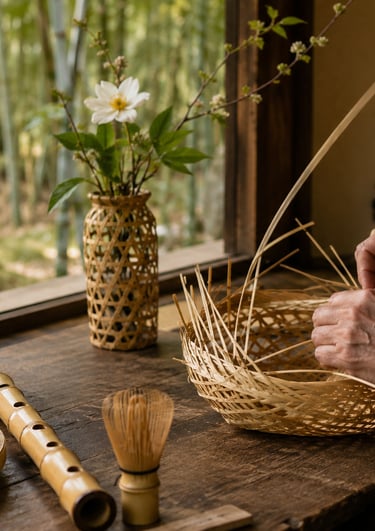 Japanese craftsman weaving a traditional bamboo basket near a window with a view of a bamboo forest.