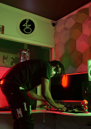 a man in a black shirt is playing a game on a computer