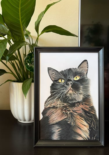 Framed custom pet portrait of a Siberian black cat with yellow eyes next to a potted plant.