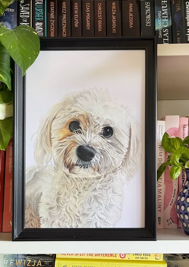 Framed custom pet portrait of a white Maltese dog next to a potted plant.