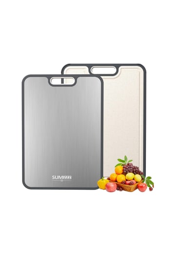 Set of two reversible stainless steel and plastic cutting boards with fresh fruit for kitchen use.