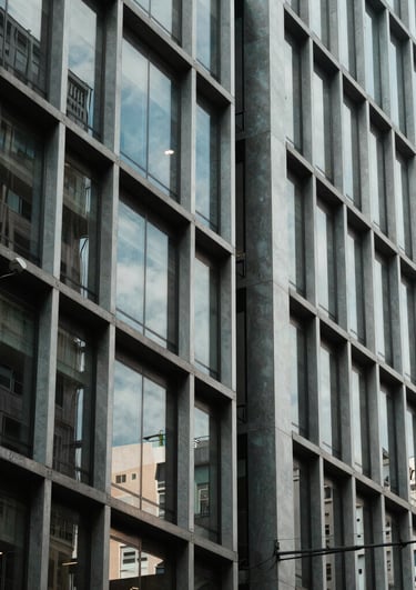 A beautiful abstract architectural photography of a modern building facade in a South American business district. Glass, steel, and symmetry. Professional vibe.