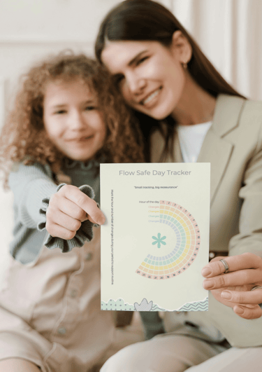 Mother and daughter hugging each other while holding paper FlowSafe Tracker to track period changes.
