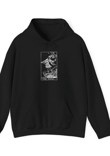 a black and white hoodie with the fool tarot on it