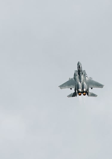 a fighter jet flying through the sky f-16