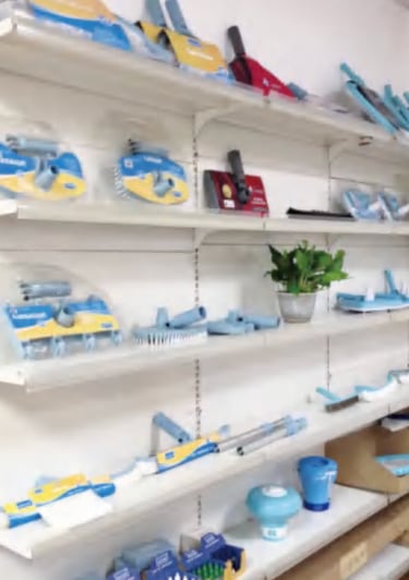 pool equipment company brushes on shelves