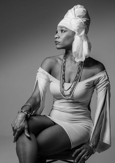 a woman in a white dress and a white head scarf